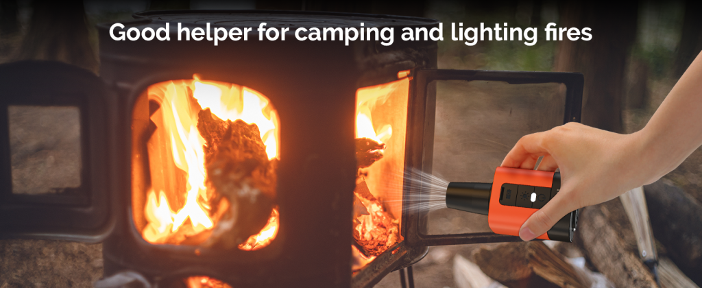 Handheld ETENWOLF Air 3 electric air pump blowing air to light a fire in a camping wood stove