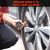 A man using ETENWOLF G200 tire pressure gauge to check SUV tire pressure with 0-75 PSI range.