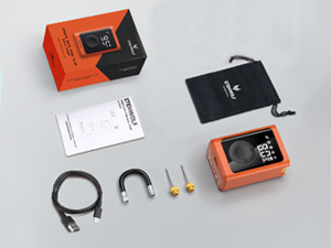 A high-angle studio shot of the ETENWOLF P300 Plus electric ball pump set, displaying the orange main unit, retail box, black drawstring bag, user manual, USB-C cable, air hose, and two needles.