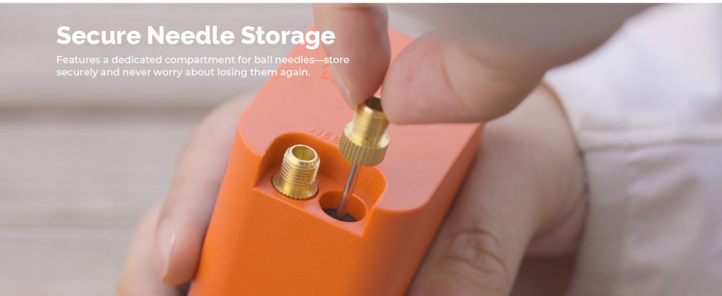 Close-up of a user placing a brass ball needle into the ETENWOLF P300 Plus dedicated onboard storage compartment to prevent needle loss.