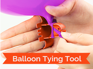 Close-up of a person using the orange balloon tying tool to knot a purple balloon quickly