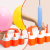 Demonstrating the inflation of round latex balloons and long twisting balloons using different nozzles