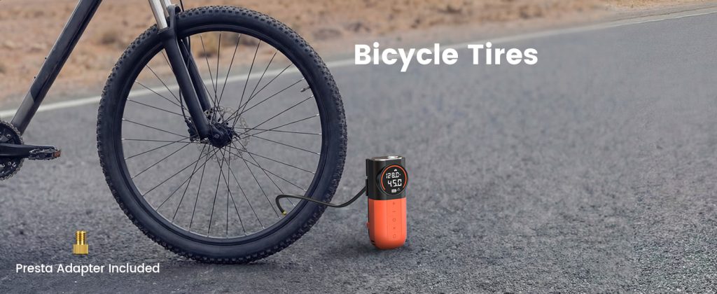 ETENWOLF S1 inflating a bicycle tire, with the included Presta adapter shown in the corner