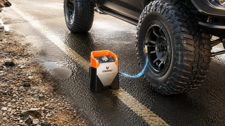ETENWOLF S5 portable tire inflator inflating an off-road truck tire