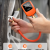 Handheld operation of ETENWOLF T600 tire gauge on a car wheel, highlighting ±0.5% accuracy, premium brass body, and the easy-to-use air release button.