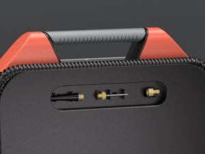 Close-up of ETENWOLF Vortex S6 showing the built-in storage compartment for valve adapters, needles, and nozzles