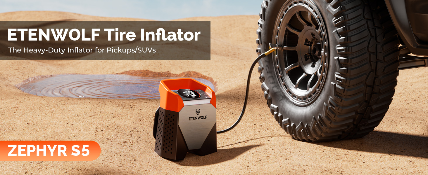 ETENWOLF Zephyr S5 portable tire inflator inflating a heavy-duty off-road tire in a desert environment.