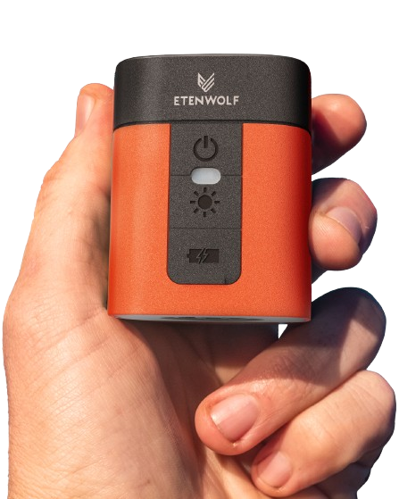 Handheld ETENWOLF Air 3 orange mini electric air pump, showcasing its compact, egg-sized portable body
