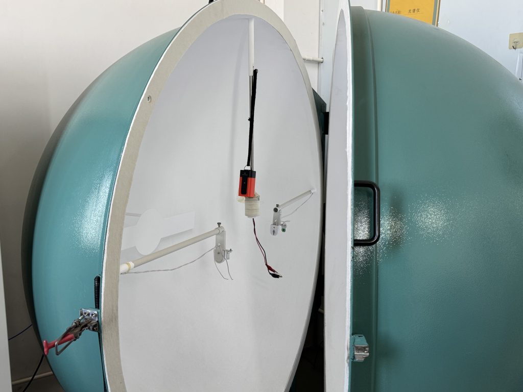 Inside view of the open integrating sphere with high-reflectance white coating and sample fixture for ETENWOLF AIR2Pro spectrometer optical testing.
