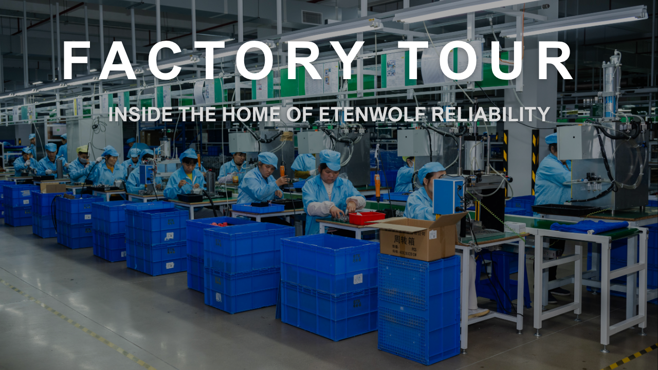 Inside ETENWOLF automotive electronics manufacturing facility showing the assembly line for portable tire inflators during a factory tour.