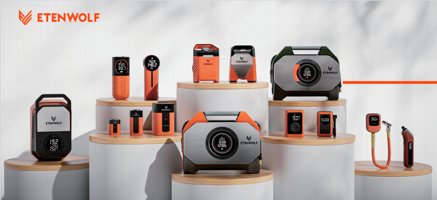 A comprehensive product lineup of ETENWOLF portable tire inflators, smart air pumps, and automotive electronic supplies displayed on modern white stands.