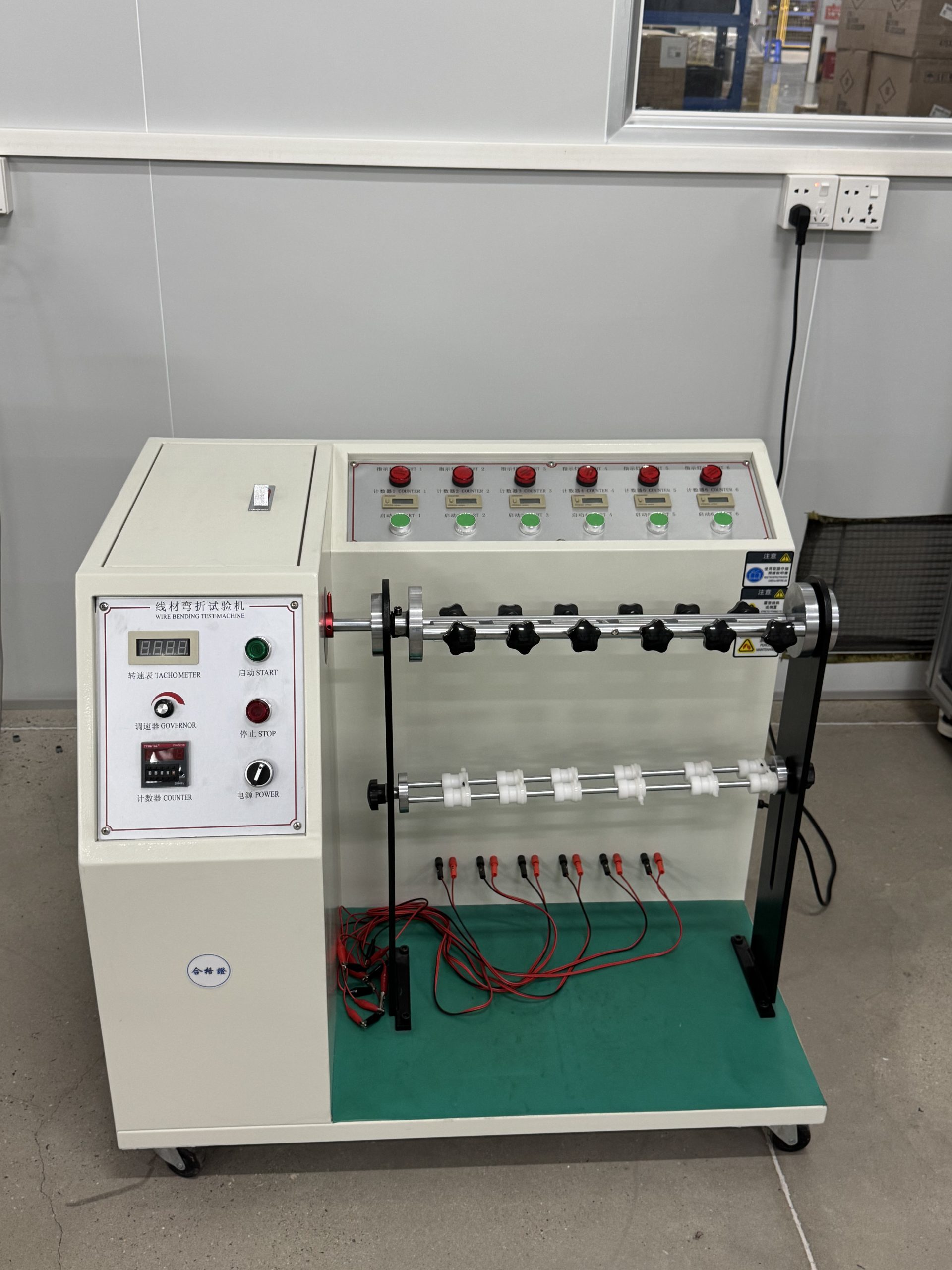 Multi-station wire bending test machine at ETENWOLF factory.