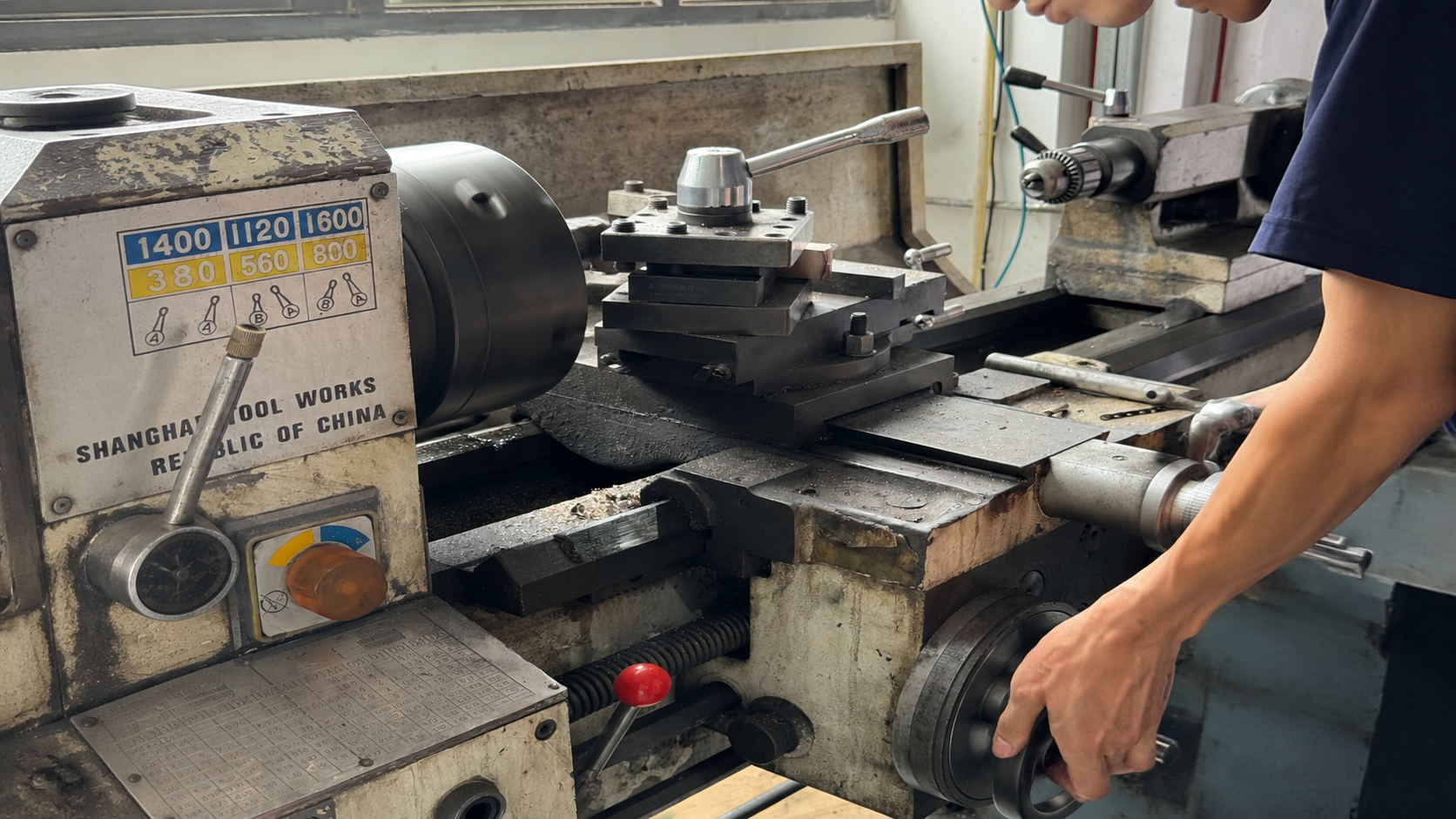 ETENWOLF workshop view of machinist operating the tool post
