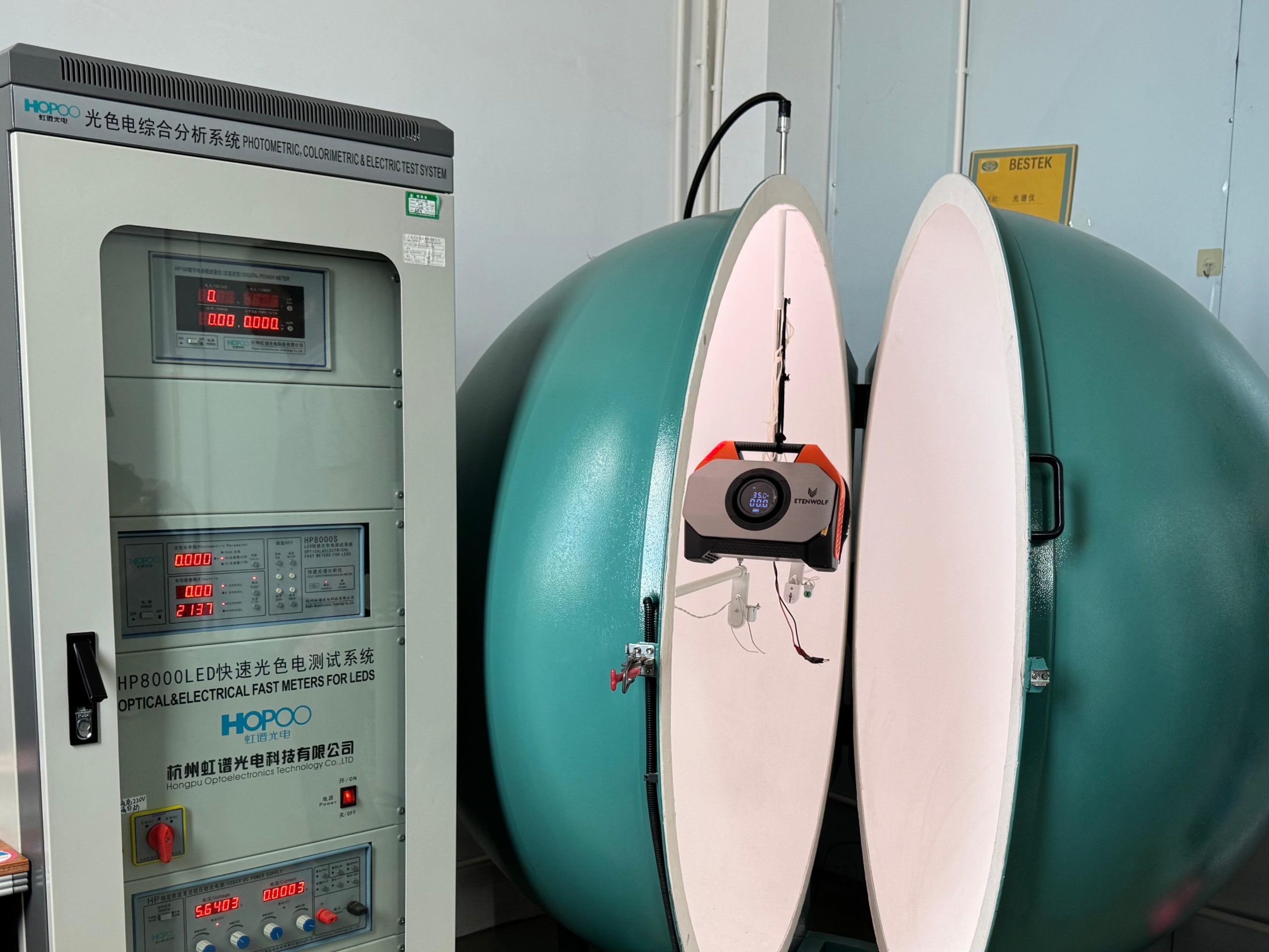 The finished ETENWOLF S6 air pump undergoing optical and electrical parameter calibration inside an integrating sphere tester