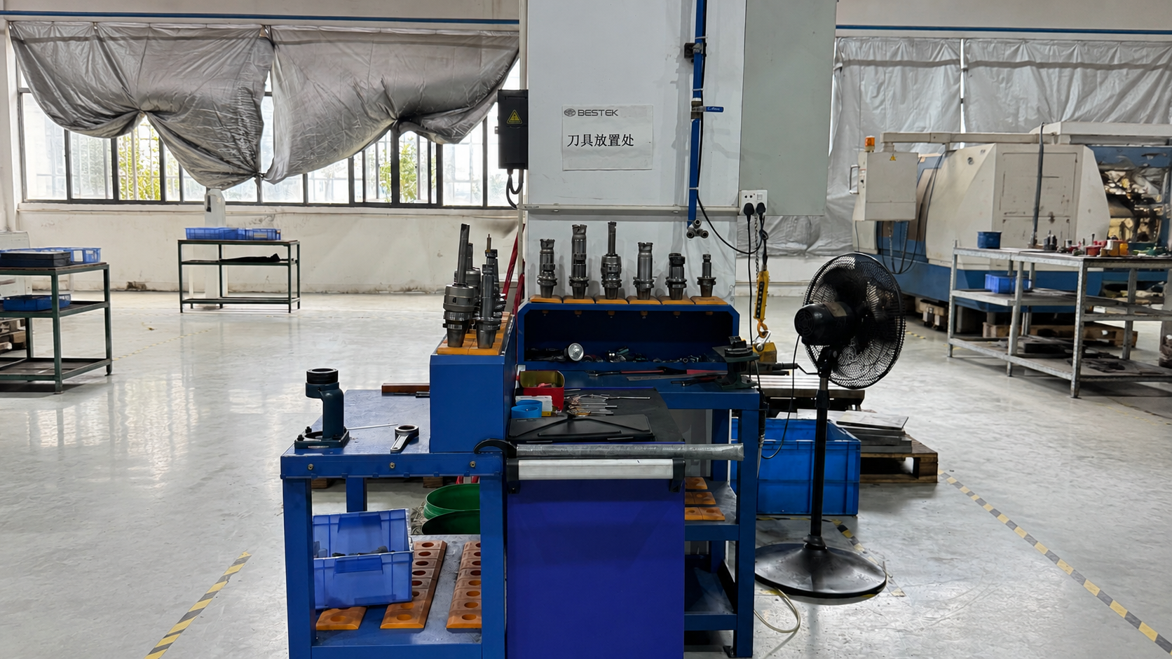 ETENWOLF mobile CNC tool cart station layout beside engraving machine in workshop